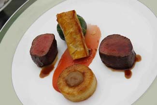 Loin of Wild Fallow Venison with Coco Roll, Quince Paste, Cabbage wrap, Chestnut Fondant & Gin Jus